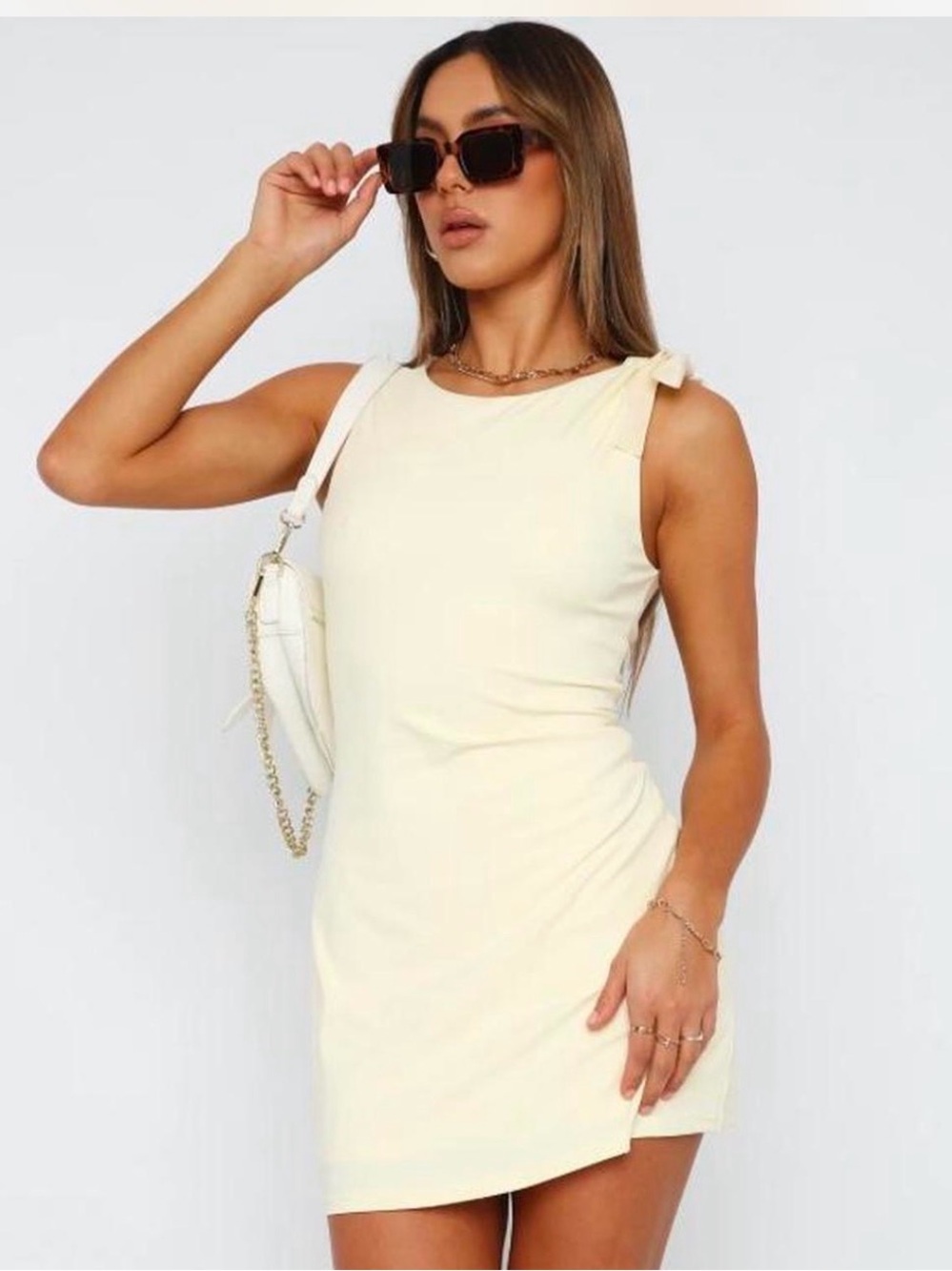 White fox pale yellow mini dress with bow detail on the shoulder size S